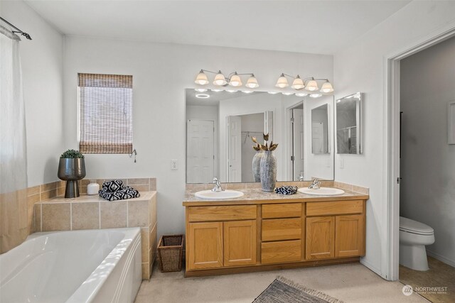 1735 SW 346th Pl, Federal Way, WA 98023 - bathroom with vanity, a bathtub, and toilet