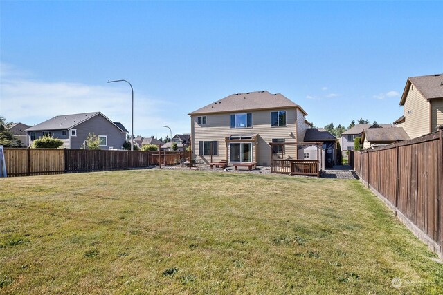 1735 SW 346th Pl, Federal Way, WA 98023 - back of property featuring a wooden deck and a yard