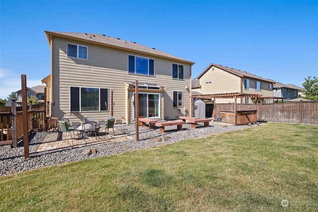 1735 SW 346th Pl, Federal Way, WA 98023 - rear view of house featuring a hot tub, a yard, a pergola, a fire pit, and a patio