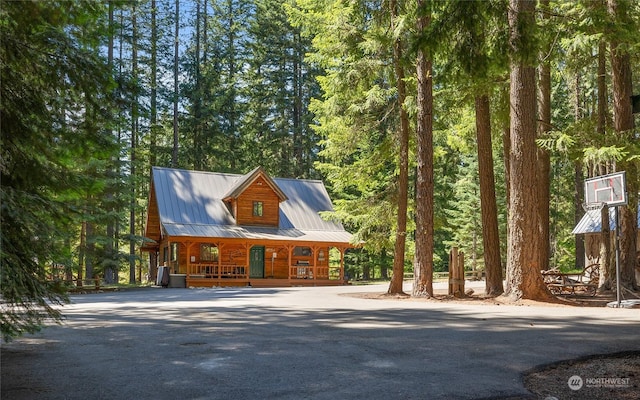 log cabin featuring a porch