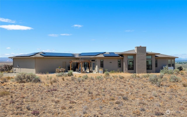 back of property with solar panels