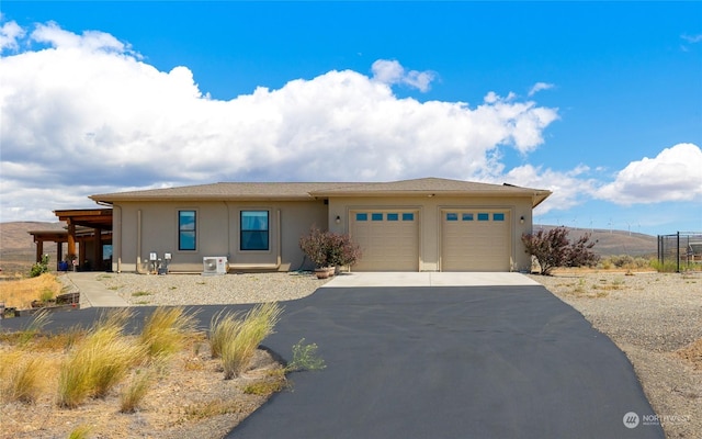 view of front of house with a garage and a mountain view