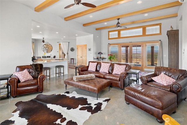 living room featuring beamed ceiling, ceiling fan, and french doors