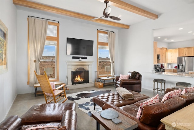 living room with beamed ceiling and ceiling fan