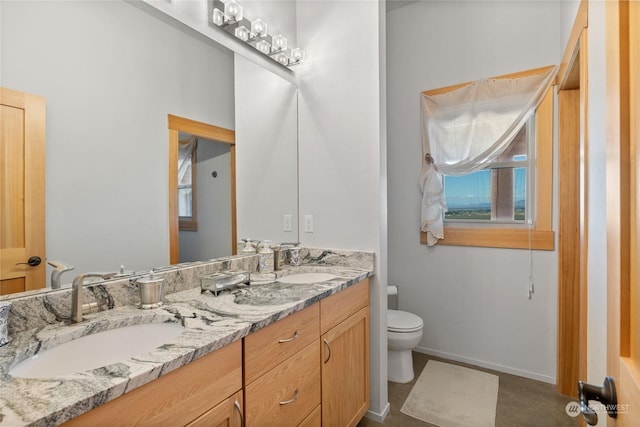 bathroom featuring vanity and toilet