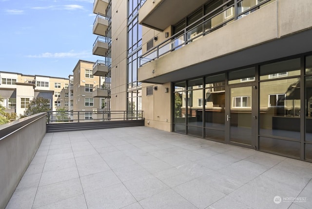 view of patio featuring a balcony