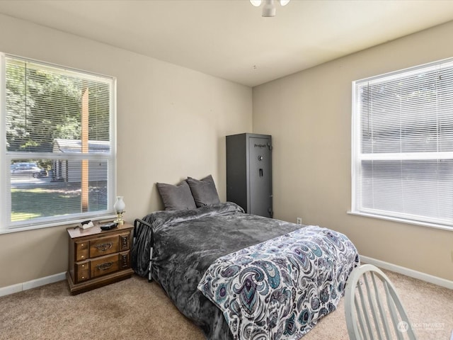 bedroom featuring light carpet