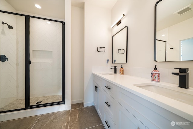 bathroom with vanity and an enclosed shower