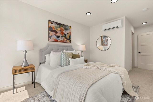 bedroom featuring light carpet and a wall unit AC