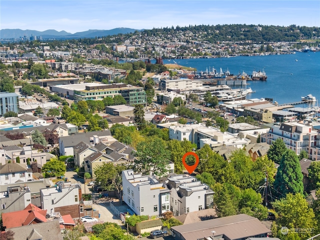 aerial view featuring a water and mountain view