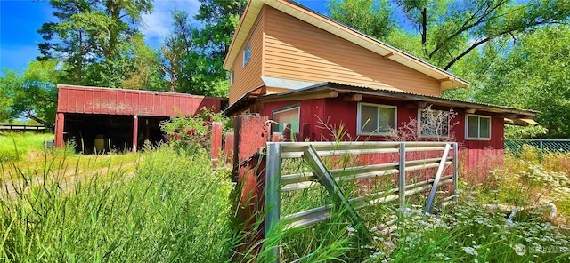 exterior space with fence and an outdoor structure