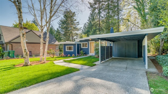 single story home with a front lawn and a carport