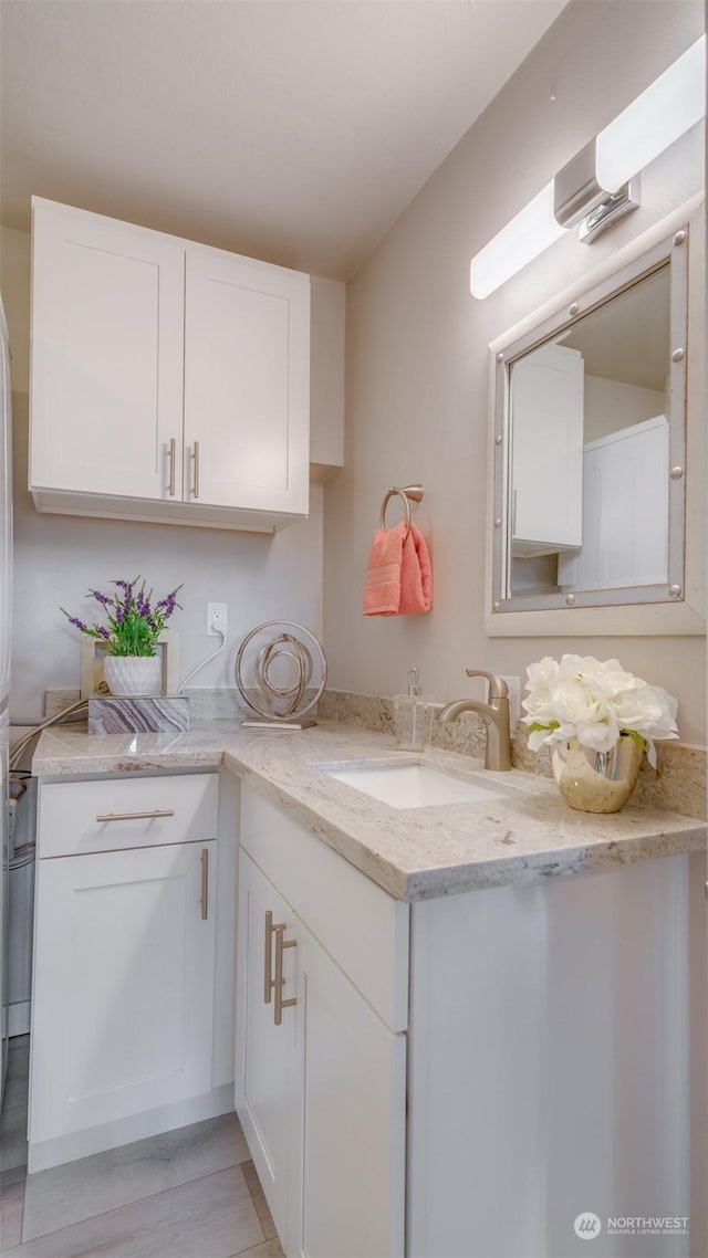 interior space with hardwood / wood-style flooring and vanity