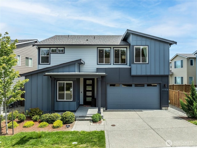 4429 Hibiscus Cir SW, Port Orchard, WA 98367 - contemporary home featuring board and batten siding, concrete driveway, an attached garage, and a shingled roof