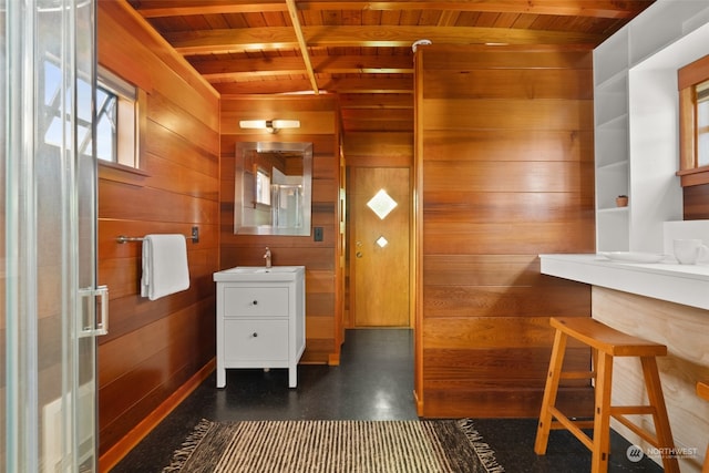 bathroom with wood ceiling, vanity, wood walls, and vaulted ceiling with beams