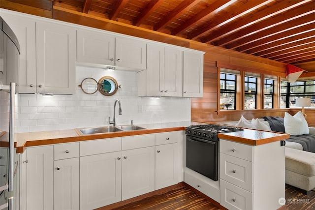 kitchen with range with gas stovetop, dark hardwood / wood-style flooring, decorative backsplash, sink, and wood ceiling