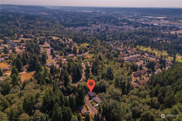 drone / aerial view featuring a forest view