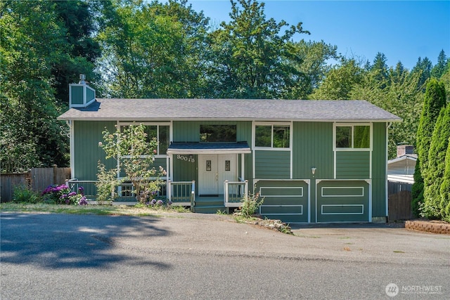 30015 108th Ave SE, Auburn, WA 98092 - bi-level home featuring driveway, a chimney, a porch, and a shingled roof