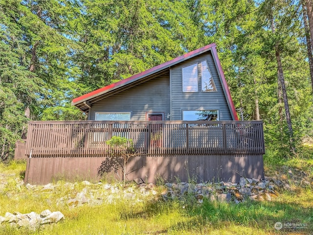 view of side of property featuring a deck