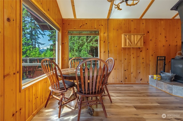 252 Snyder Rd, Packwood, WA 98361 - dining space featuring wooden walls, light hardwood / wood-style flooring, and vaulted ceiling
