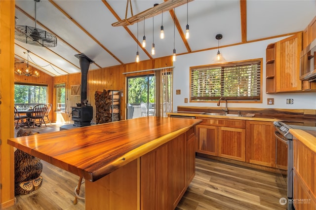 252 Snyder Rd, Packwood, WA 98361 - kitchen featuring wooden counters, a wood stove, sink, light hardwood / wood-style floors, and stainless steel electric range oven