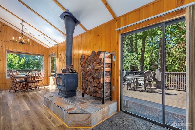 252 Snyder Rd, Packwood, WA 98361 - interior space featuring vaulted ceiling with beams, a chandelier, and a wood stove