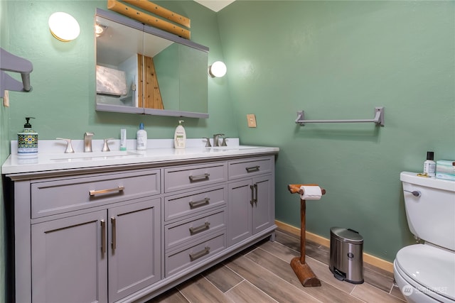252 Snyder Rd, Packwood, WA 98361 - bathroom with double vanity, hardwood / wood-style flooring, and toilet