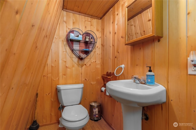 252 Snyder Rd, Packwood, WA 98361 - bathroom featuring wooden walls, lofted ceiling, toilet, wooden ceiling, and wood-type flooring