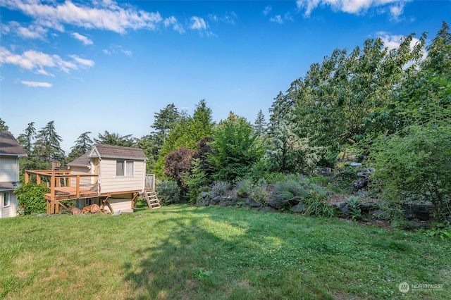 view of yard with a wooden deck