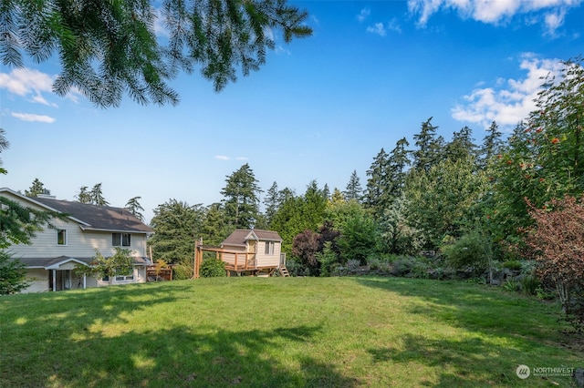 view of yard with a wooden deck