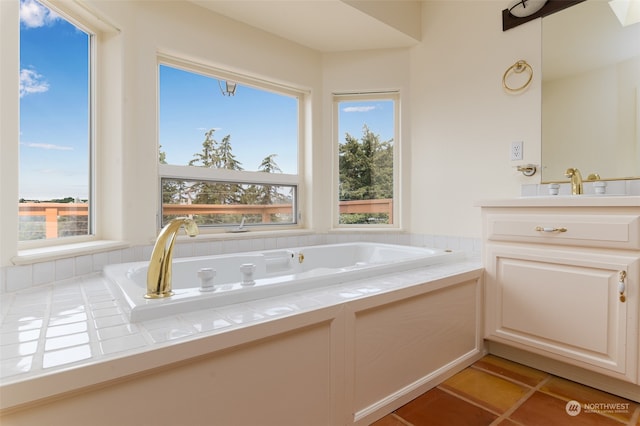 bathroom featuring tile patterned floors, a bathtub, and plenty of natural light