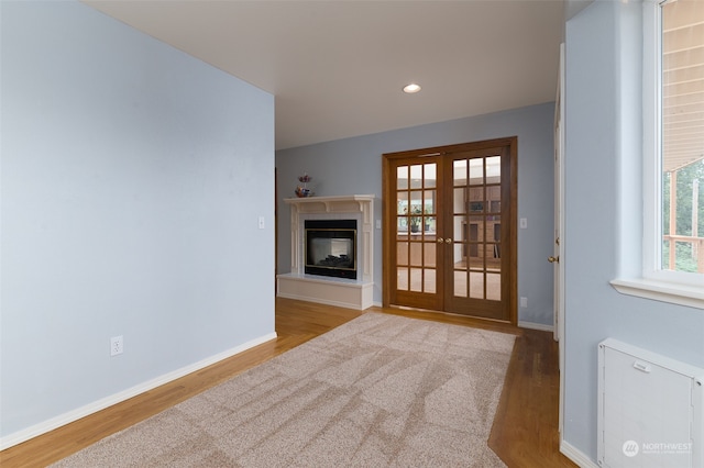 interior space featuring light hardwood / wood-style flooring and french doors