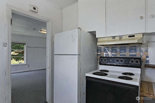 kitchen with white cabinets, white refrigerator, and electric stove