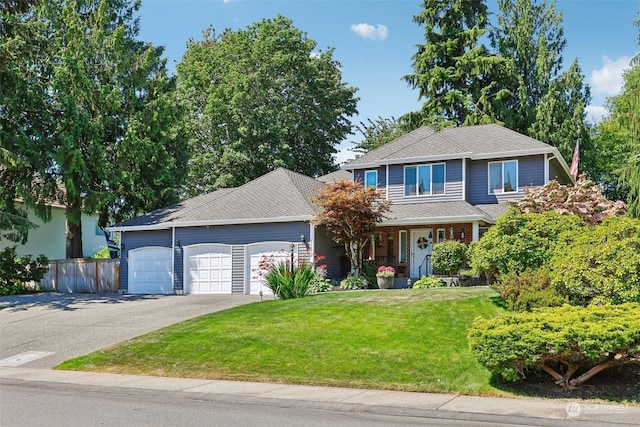 front facade featuring a front yard and a garage