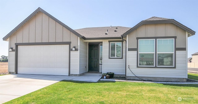 single story home featuring board and batten siding, a shingled roof, a front yard, a garage, and driveway