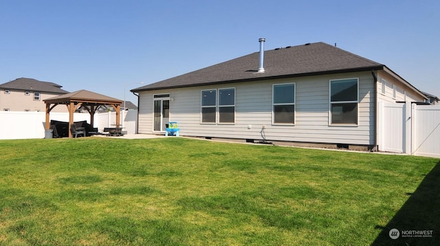 rear view of property with a gazebo, a fenced backyard, a patio area, and a yard