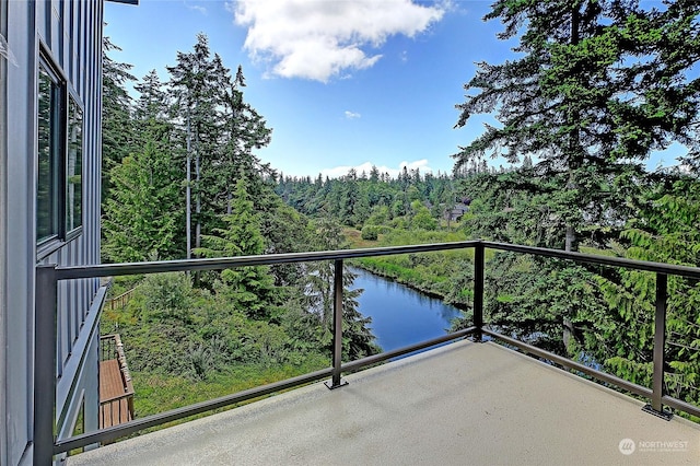 balcony featuring a water view