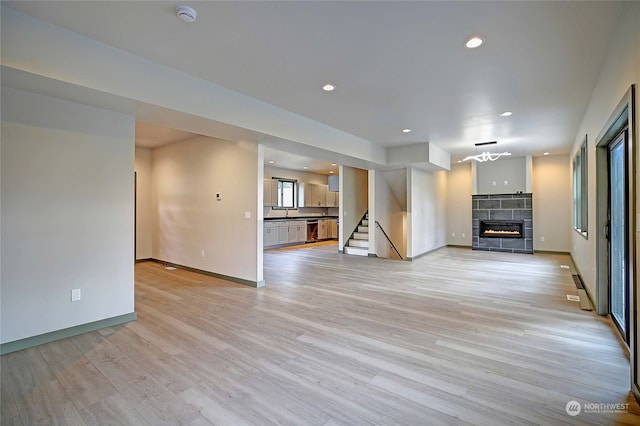 unfurnished living room with light hardwood / wood-style floors