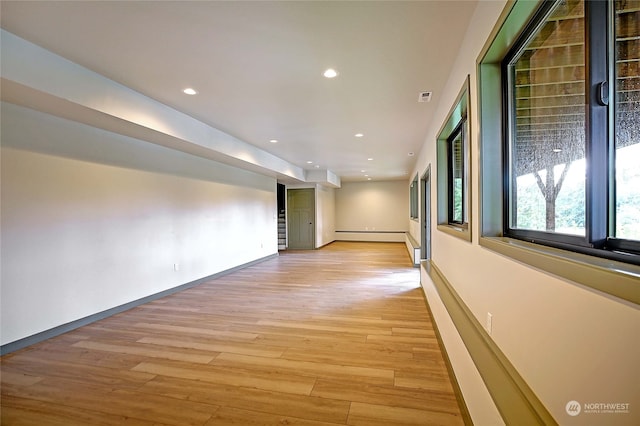 hall with light wood-type flooring