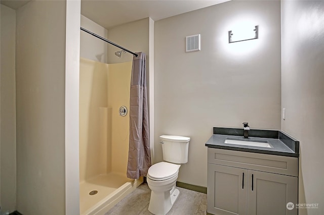 bathroom featuring tile patterned floors, vanity, toilet, and curtained shower