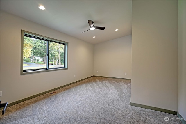 carpeted empty room with ceiling fan