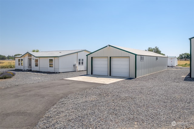 exterior space featuring an outbuilding and a garage