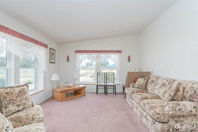 living room with vaulted ceiling and carpet flooring