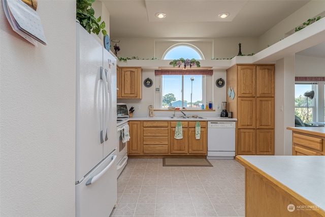 kitchen with sink and white appliances