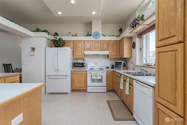 kitchen with white appliances and sink