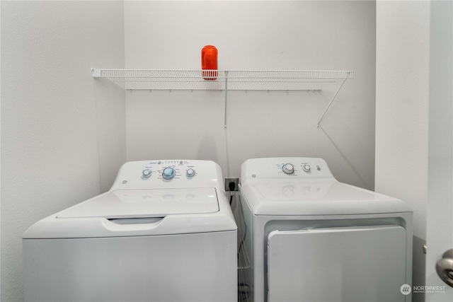 laundry room with washing machine and dryer