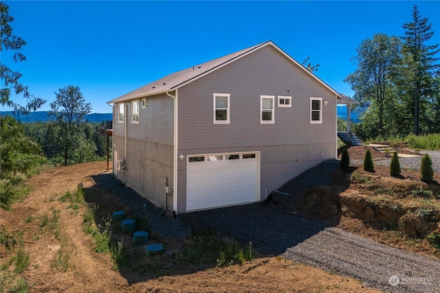 view of side of home with a garage