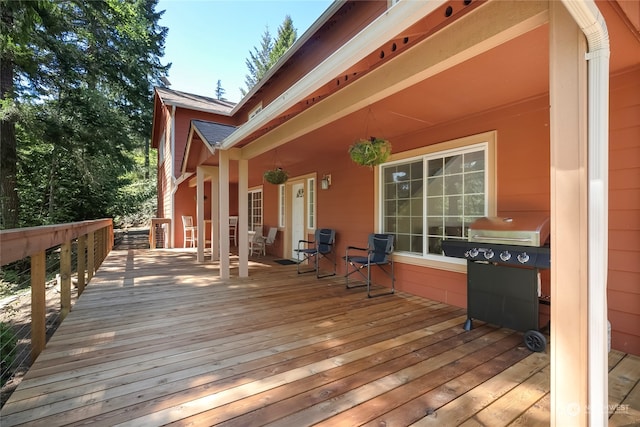 wooden terrace featuring area for grilling