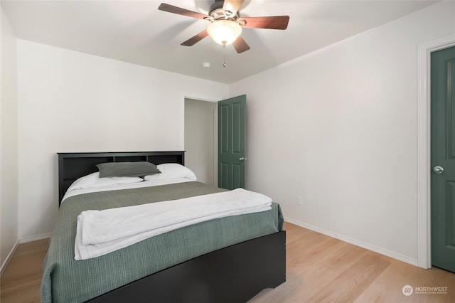 bedroom featuring ceiling fan and light hardwood / wood-style flooring