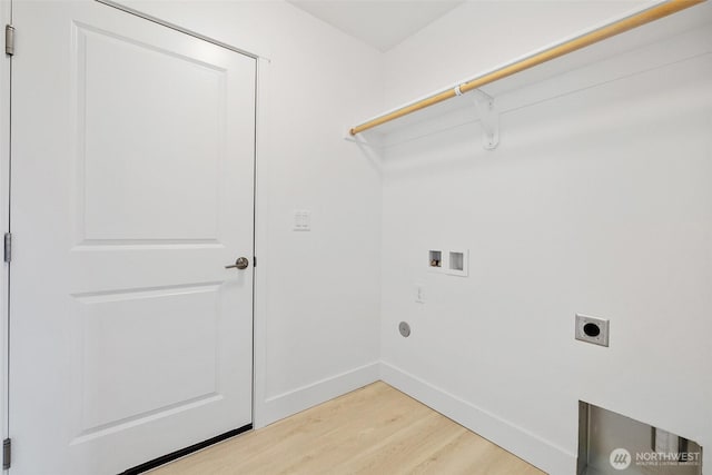 clothes washing area featuring laundry area, baseboards, light wood-type flooring, washer hookup, and electric dryer hookup